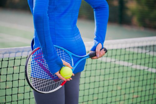 Woman playing Tennis