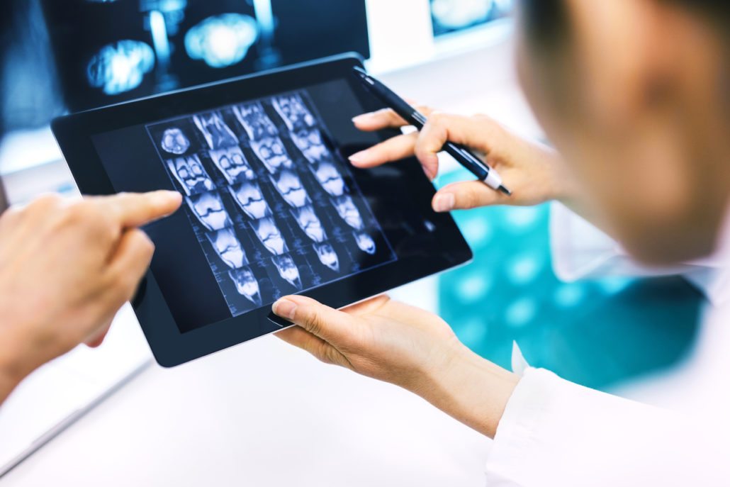 Doctor Using A Digital Tablet For His Diagnosis Radiology Indiana About Us Radiologists