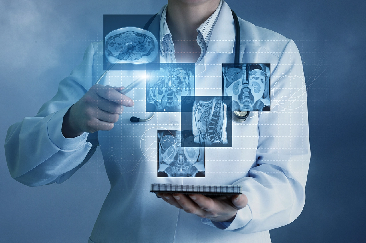 Indiana's top radiologists: radiologist holding a tablet with x-ray holograms
